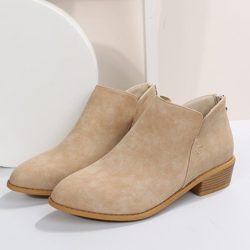 Side view of women's low heel work boots, highlighting the smooth slip-on entry and ankle support.