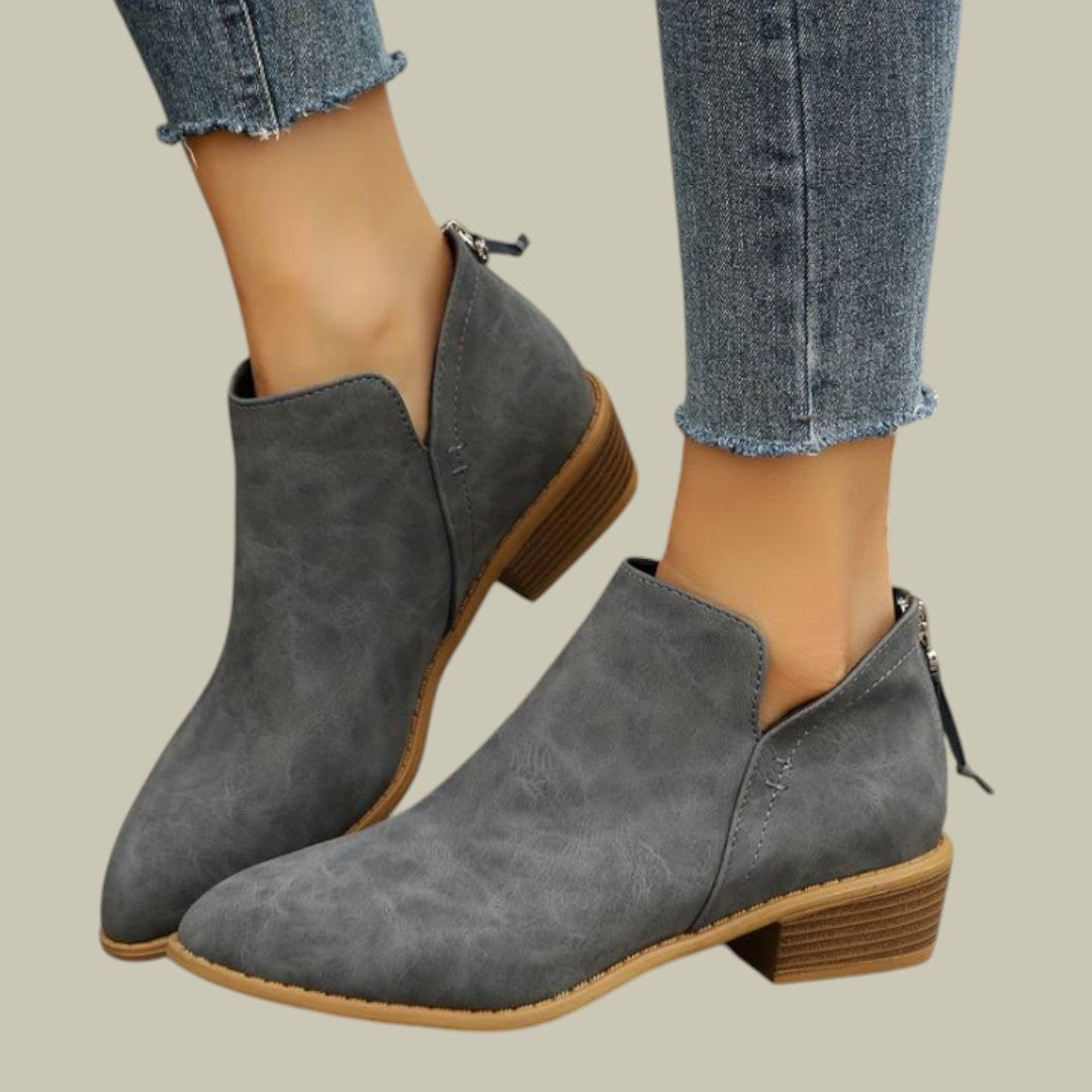 Durable and stylish women's ankle boots, offering a comfortable low heel and easy slip-on access.