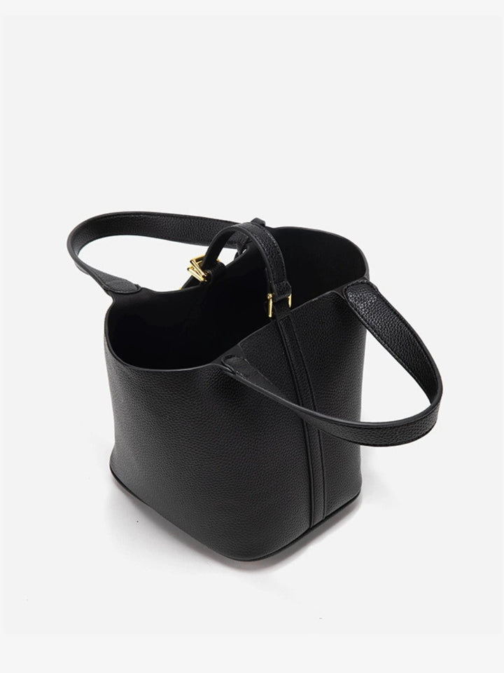 Fashionable women's accessory: taupe leather bucket bag