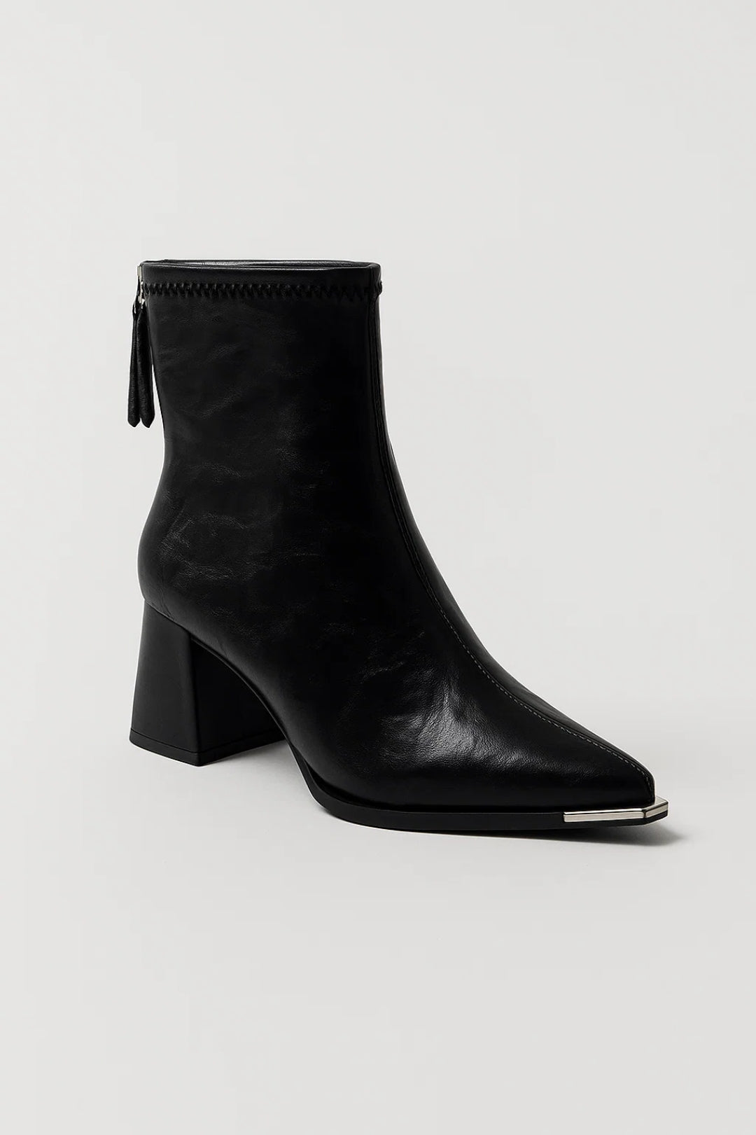 Stylish women's block heel ankle boots in a versatile neutral shade, offering comfort and fashion.