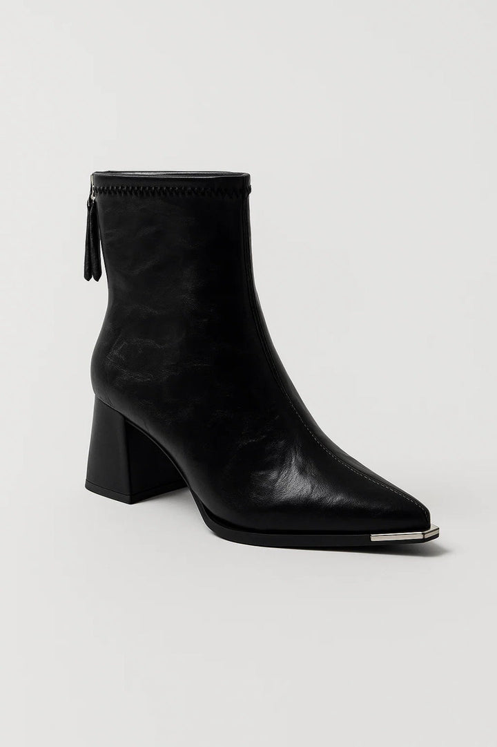 Stylish women's block heel ankle boots in a versatile neutral shade, offering comfort and fashion.