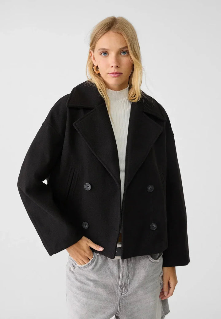 Chic women's tailored cropped jacket, double-breasted for elegant fall & winter fashion.