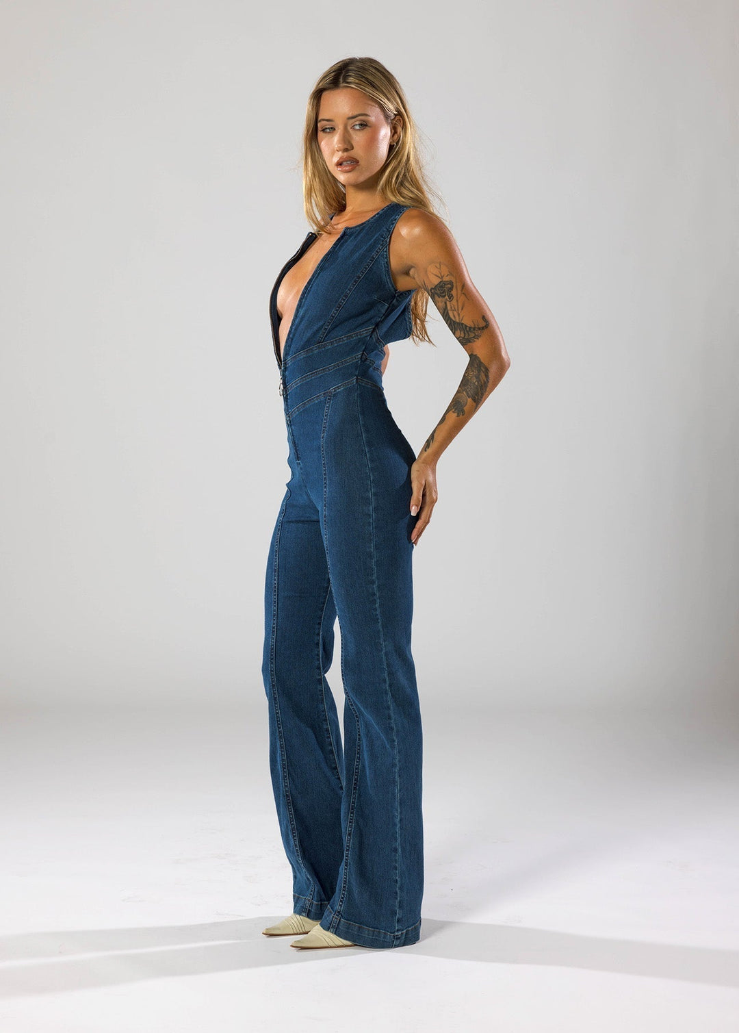 Figure-hugging navy blue denim jumpsuit with a flattering heart design