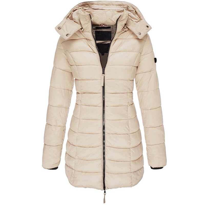 Full-body shot of a woman wearing the Olivia warm hooded jacket outdoors.