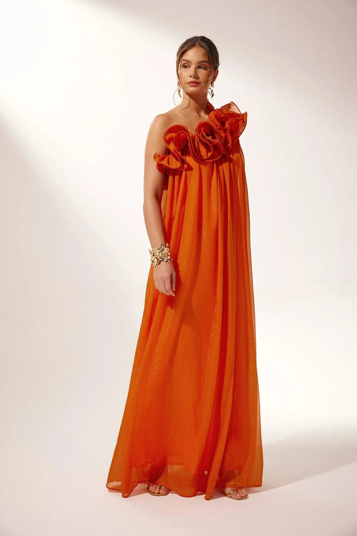 A beautiful one-shoulder formal dress in vibrant orange with a delicate floral pattern.