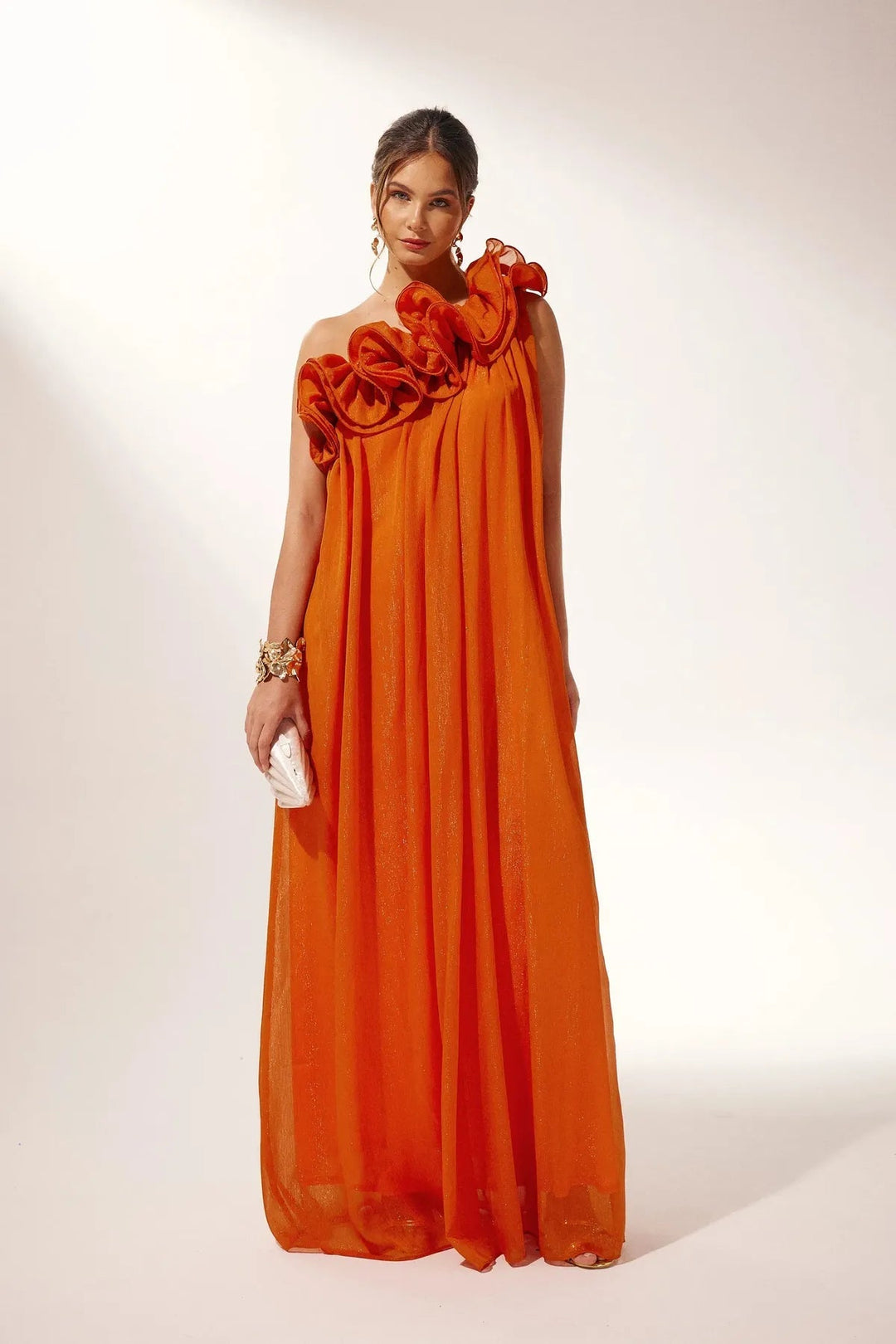Women's striking orange floral maxi dress with a flattering one-shoulder silhouette.