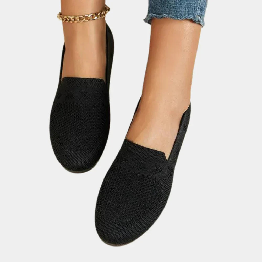 Close-up of women's comfort shoes highlighting the orthopedic arch support design.