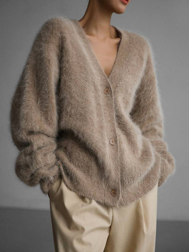 Cozy and versatile women's knit cardigan, featuring an oversized, button-up design.