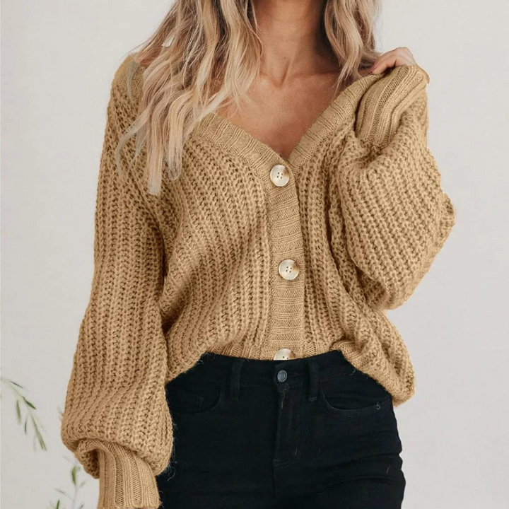 Women's oversized chunky knit V-neck cardigan with stylish balloon sleeves.