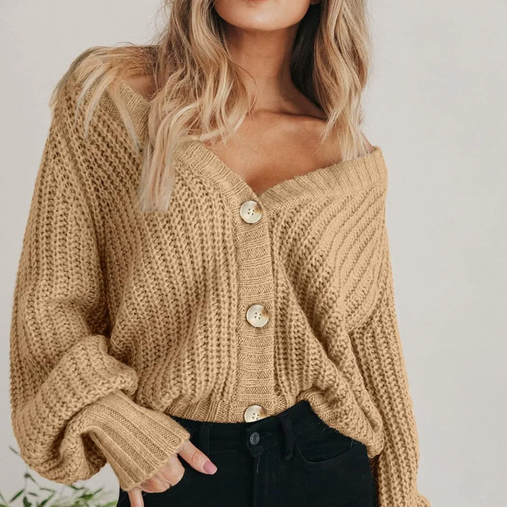 Cozy V-neck chunky knit cardigan for women, featuring trendy balloon sleeves.
