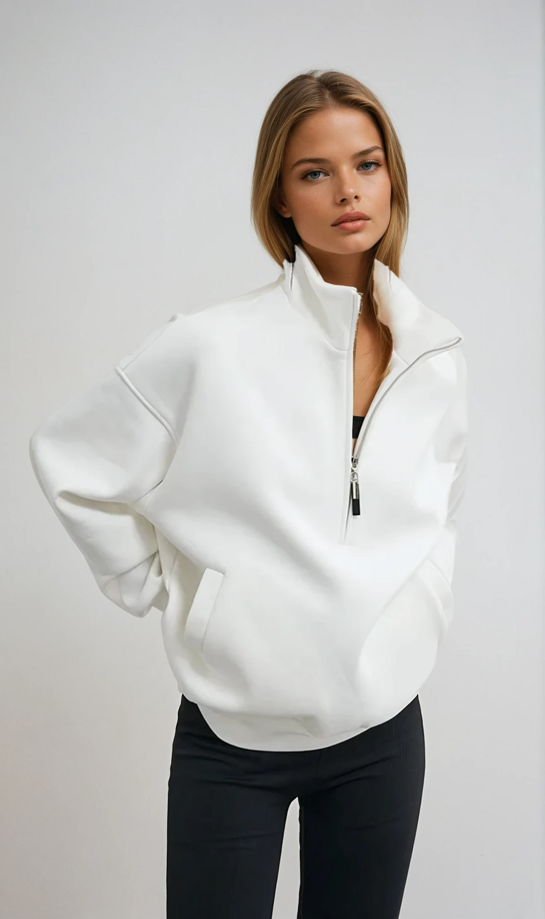 Women's oversized half-zip pullover hoodie in a relaxed fit, ideal for cozy loungewear & casual winter fashion.