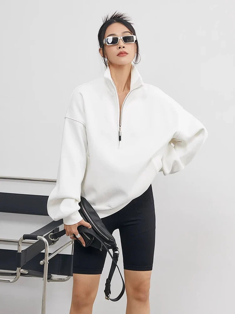 Comfortable women's oversized half-zip pullover hoodie, a cozy top for casual, relaxed fit everyday style.
