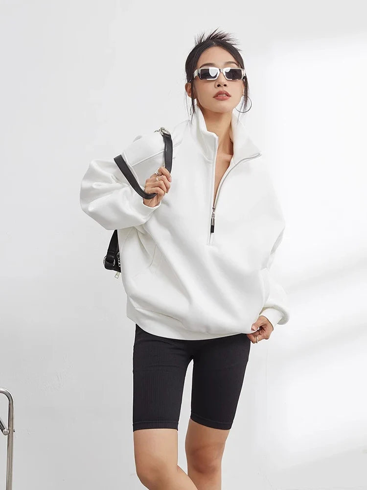 Womenswear oversized half-zip hoodie, a cozy pullover for casual wear, winter fashion, and comfortable loungewear.