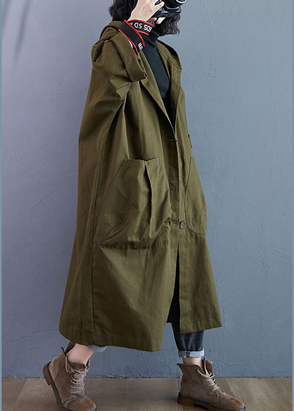 Longline women's trench coat with hood & button front. Oversized seasonal jacket, a fashionable outerwear choice.
