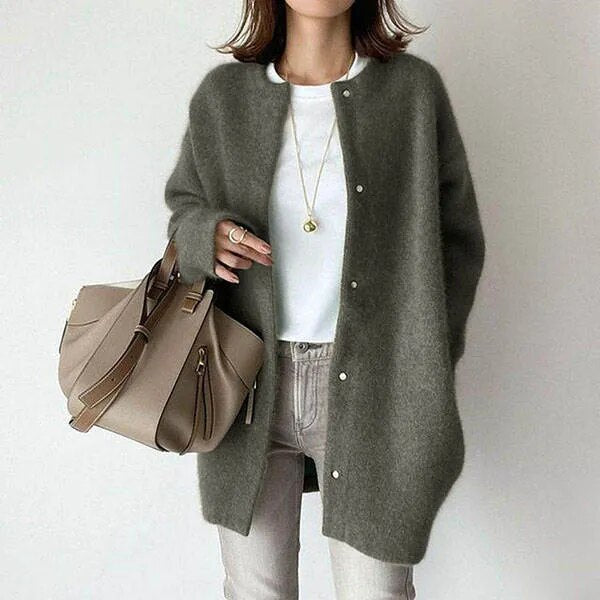 Women's oversized knit cardigan with a longline silhouette, perfect for fall fashion.