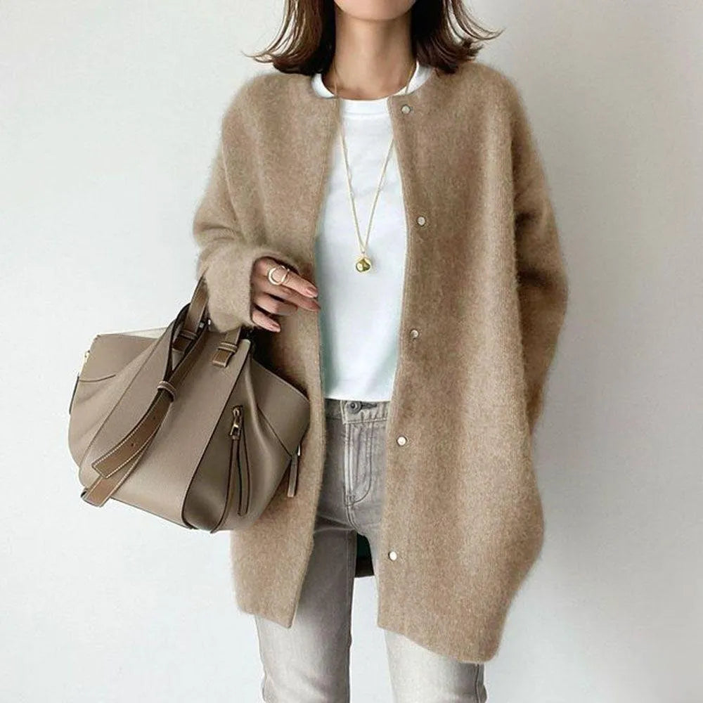 Cozy and warm women's long cardigan made from soft knit material, ideal for winter style.