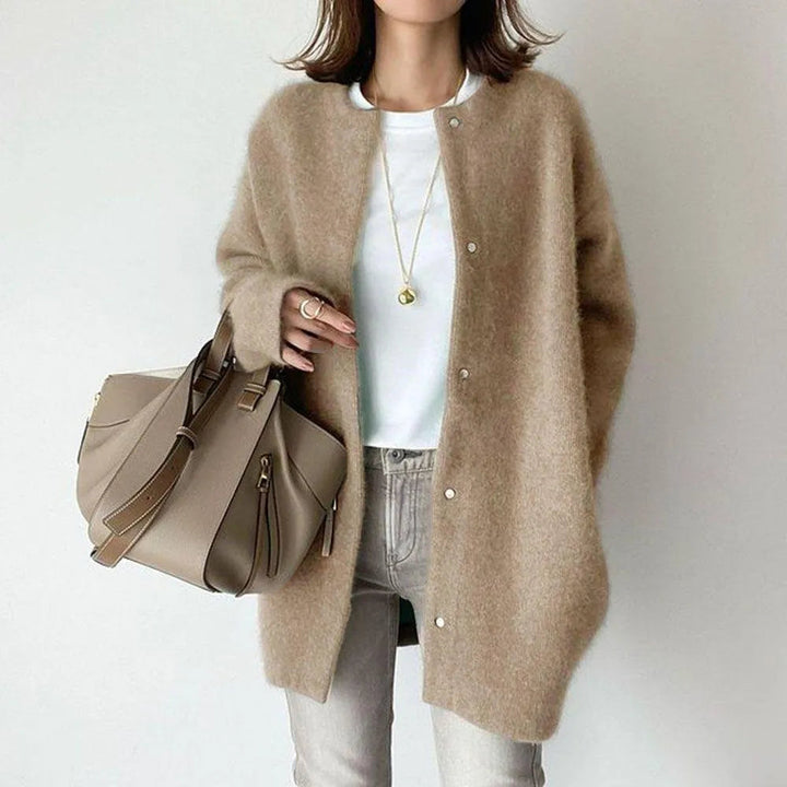 Cozy and warm women's long cardigan made from soft knit material, ideal for winter style.