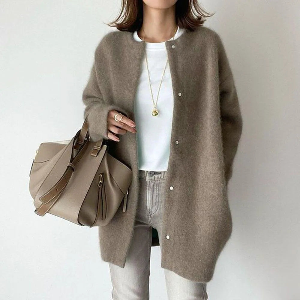 Effortlessly layer with this women's oversized knit cardigan, perfect for cooler weather.
