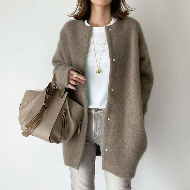 Effortlessly layer with this women's oversized knit cardigan, perfect for cooler weather.