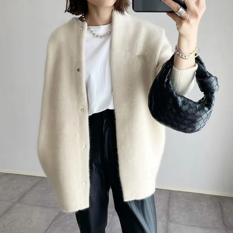 Classic button-up women's long cardigan in a comfortable oversized knit, your go-to for casual style.