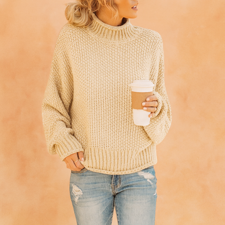 Relaxed fit women's oversized turtleneck sweater. Comfy and casual, ideal for everyday winter fashion.