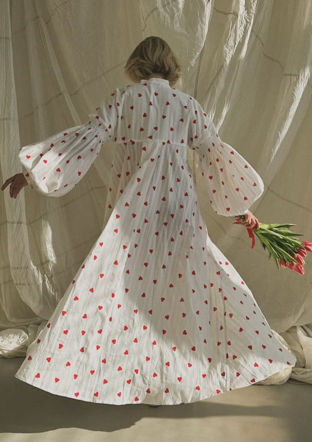 Stylish women's white maxi dress with an oversized fit and heart detail