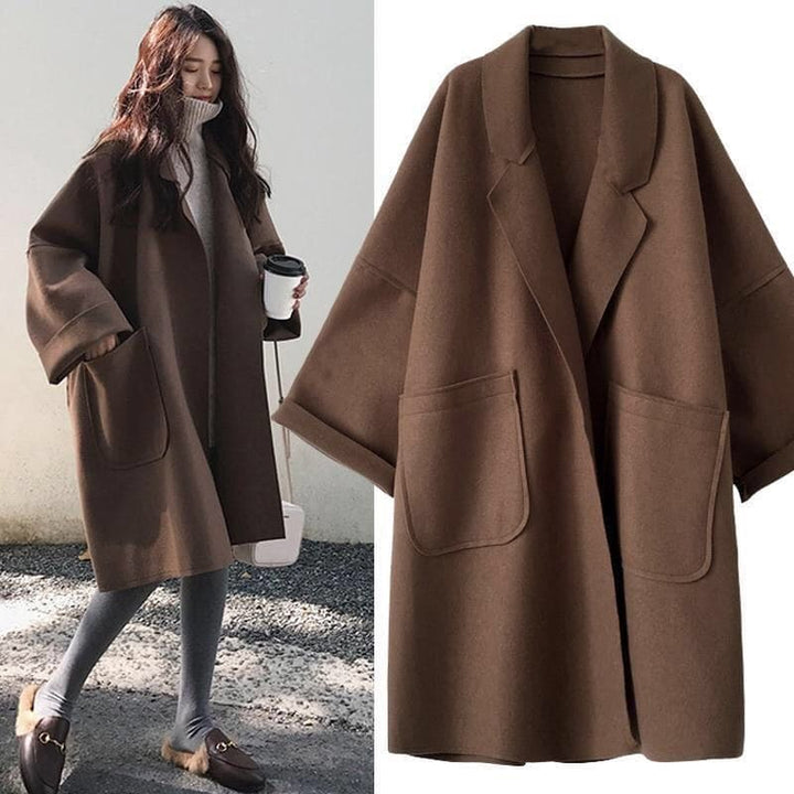 Women's oversized wool blend trench coat with a belted waist, perfect for classic fall fashion.
