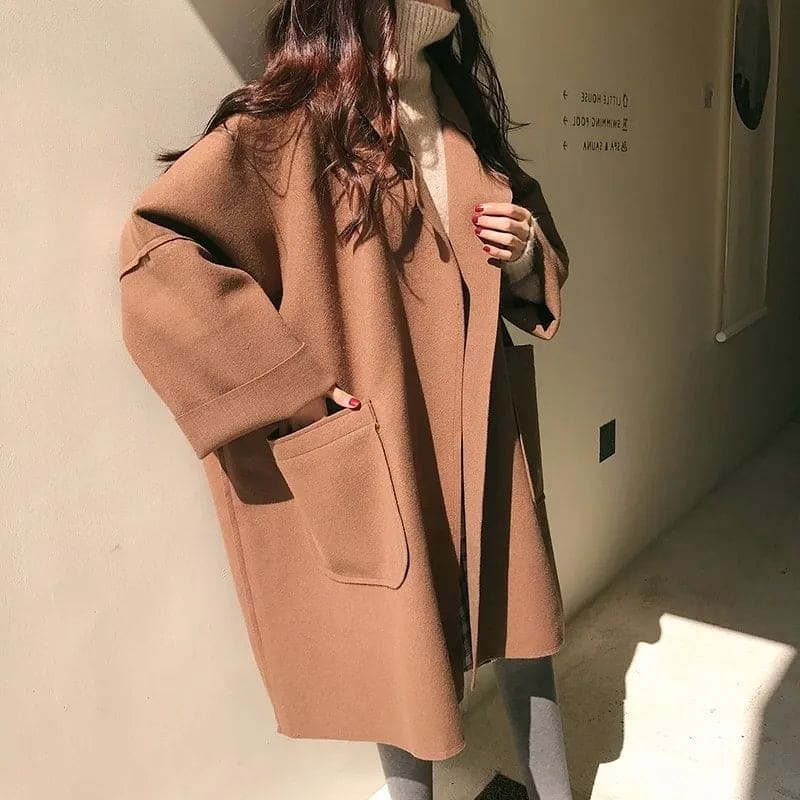 Women's fall/spring oversized trench coat. Classic wool blend outerwear with a chic belted waist.