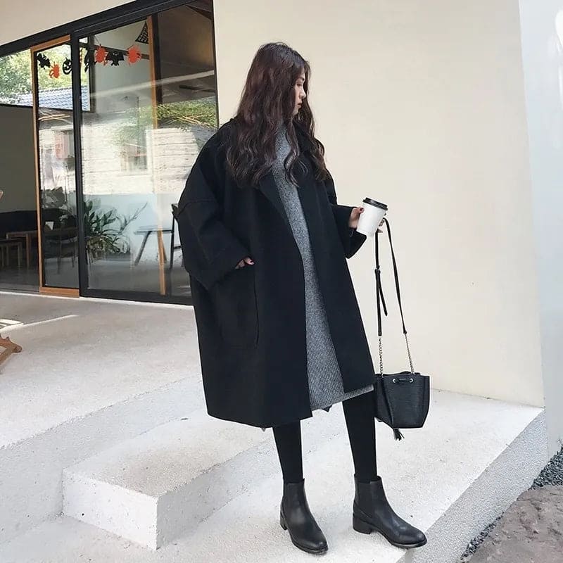 Aura oversized wool blend trench coat for women, offering a classic, elegant, belted style.