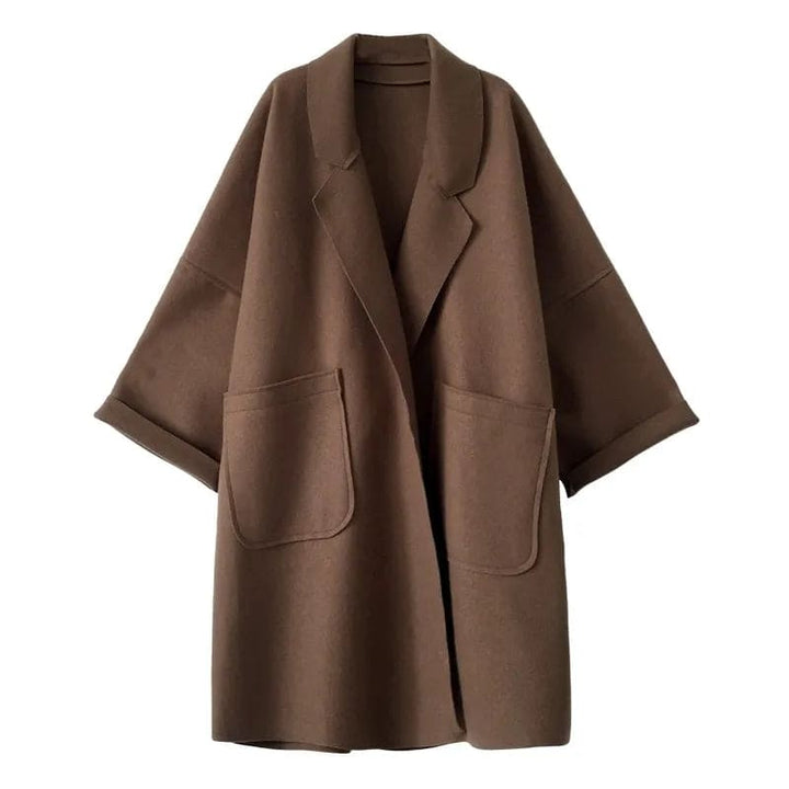 Trendy women's oversized trench coat. A classic, elegant belted long jacket, ideal for spring outerwear.