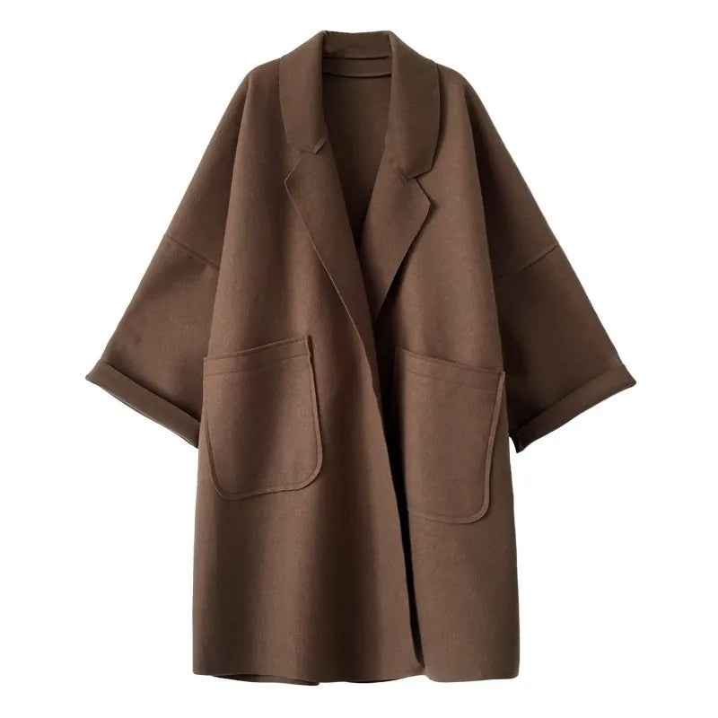 Chic women's oversized wool blend belted trench coat. Perfect long outerwear for elegant fall and spring fashion.