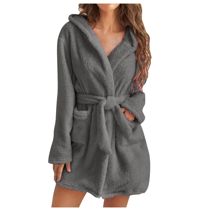 Soft white women's hooded bathrobe crafted from plush coral fleece, essential sleepwear.