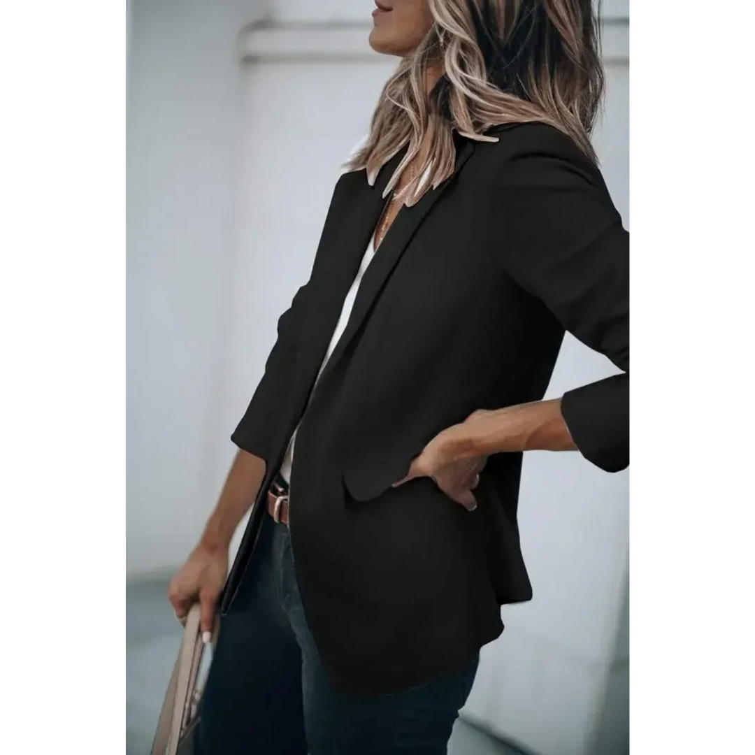 Stylish women's blazer featuring prominent puff sleeves & a comfortable loose fit, ideal for modern fashion.