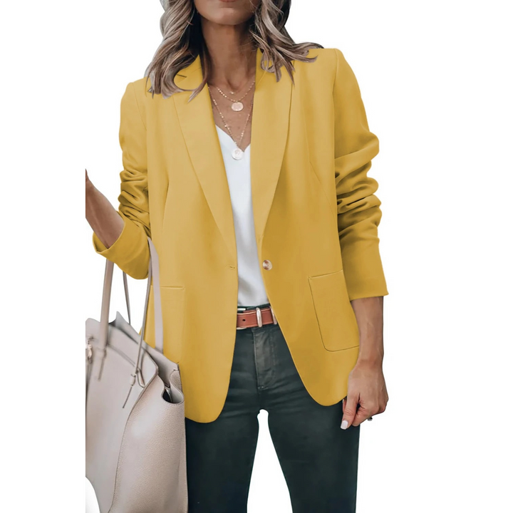 Elegant women's fashion blazer, Mia, with chic puff sleeves & a versatile loose fit for stylish outerwear.