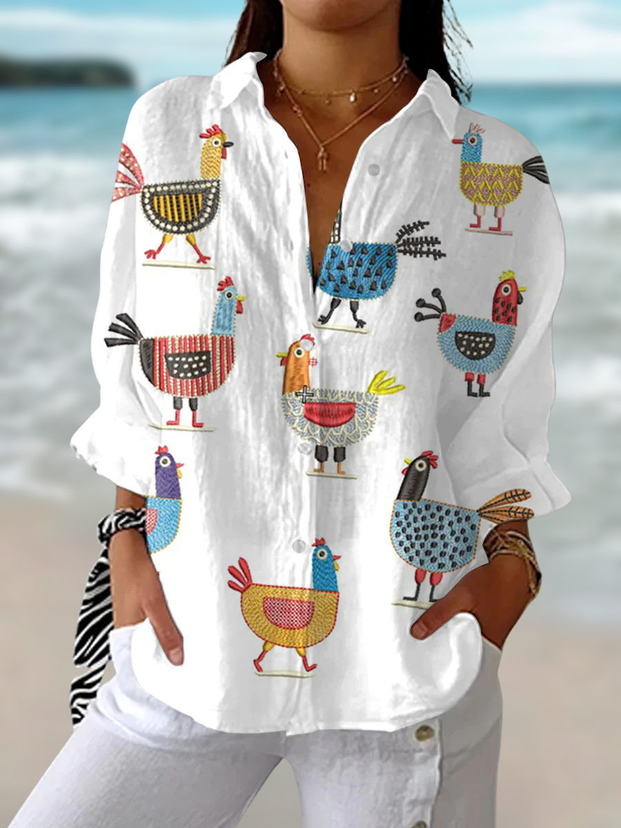 Women's playful hen print relaxed fit blouse. Charming whimsical animal print top for casual everyday spring fashion.