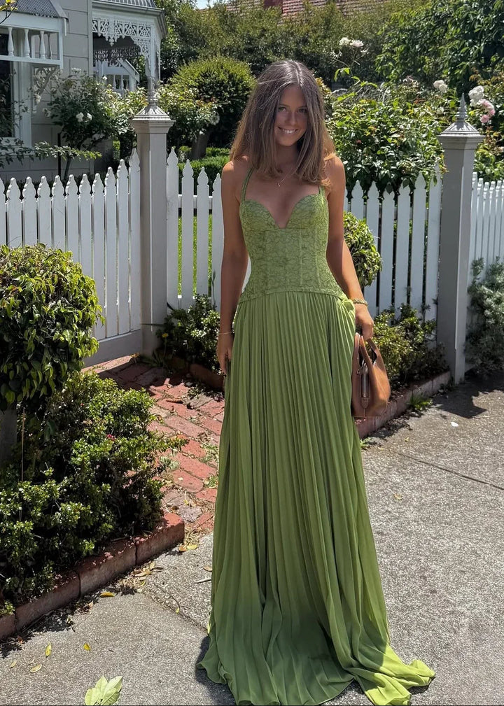 Formal women's halter neck maxi dress with pleats, ideal for special occasions & elegant summer events.