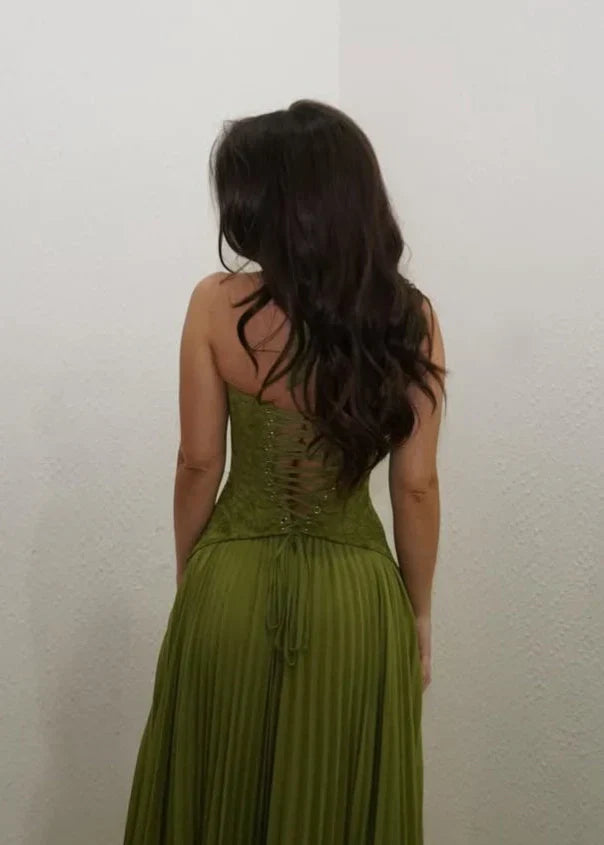 Flowy pleated maxi dress for women with a halter neck, suitable for formal events and wedding guest attire.