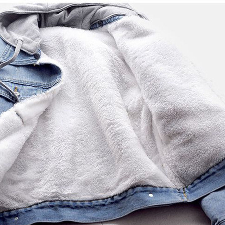 Curvy woman models a comfortable plus size light blue hooded denim jacket, ideal for casual outings & layering.