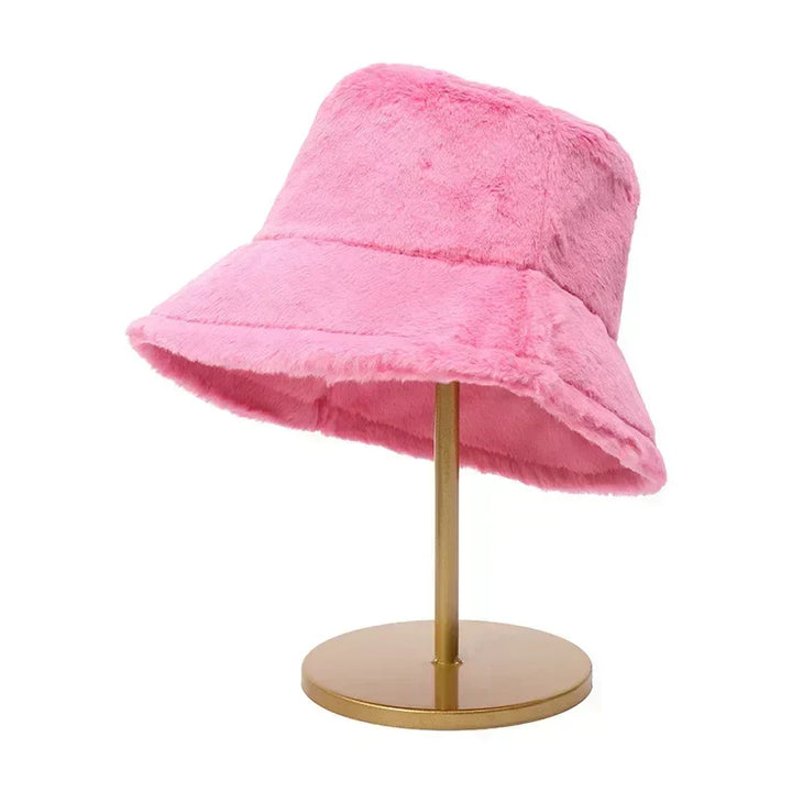 Soft women's headwear: plush faux rabbit fur bucket hat, perfect for winter outfits.