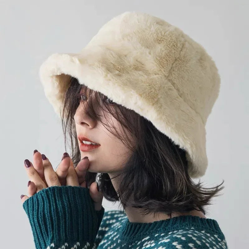 Stylish women's faux fur bucket hat, a plush and warm accessory for cold weather fashion.