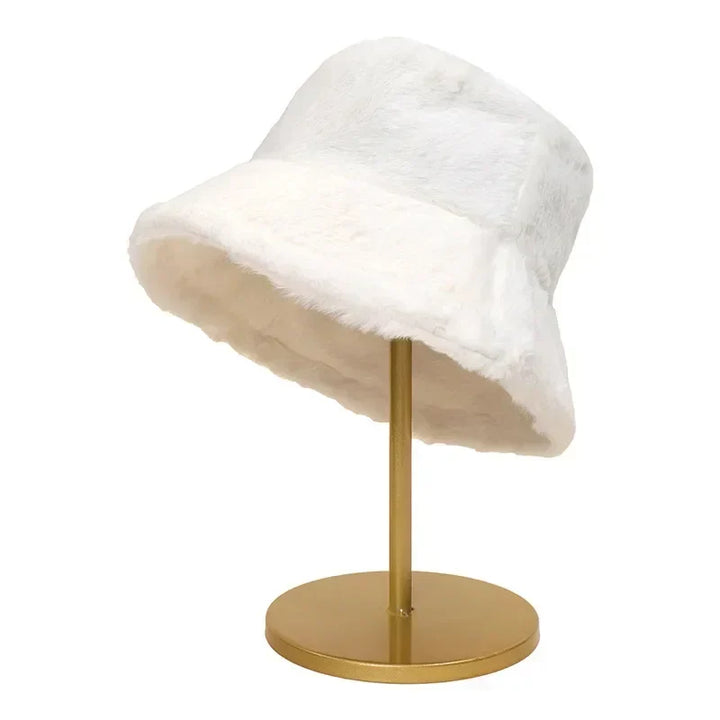 Autumn fashion women's headwear: soft faux rabbit fur bucket hat, a cozy accessory.