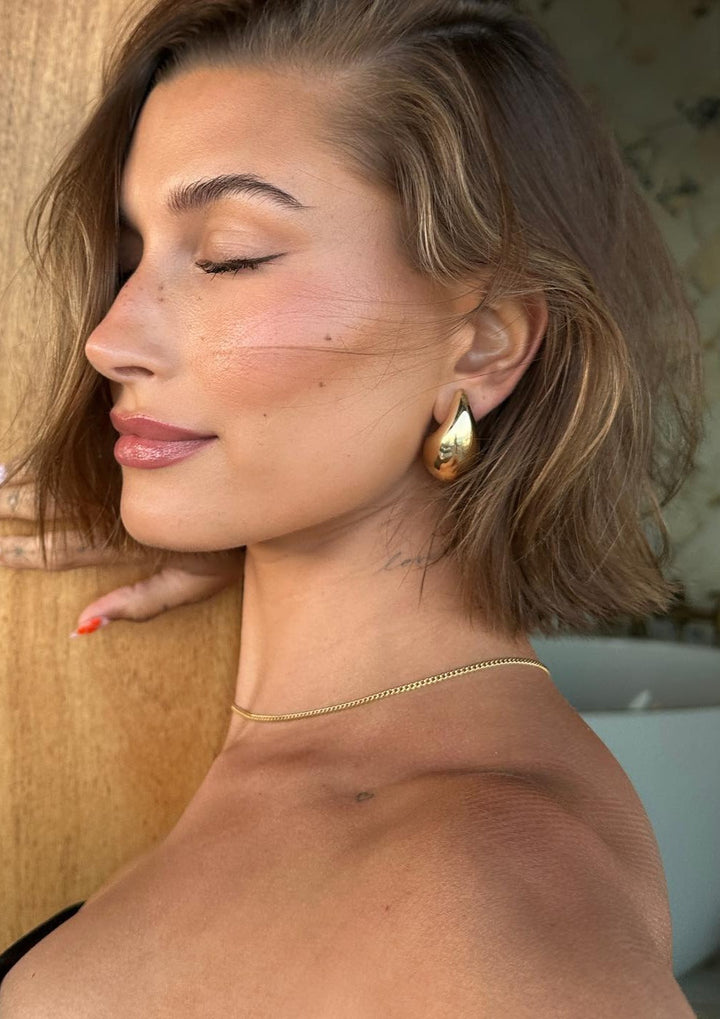 Women's polished teardrop dangle earrings, elegant stainless steel jewellery.