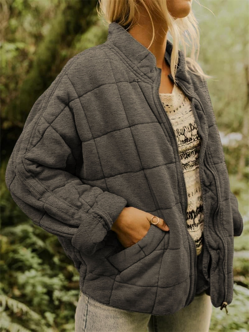 Women's quilted zip-front casual jacket with stand collar, perfect for stylish layering outerwear.