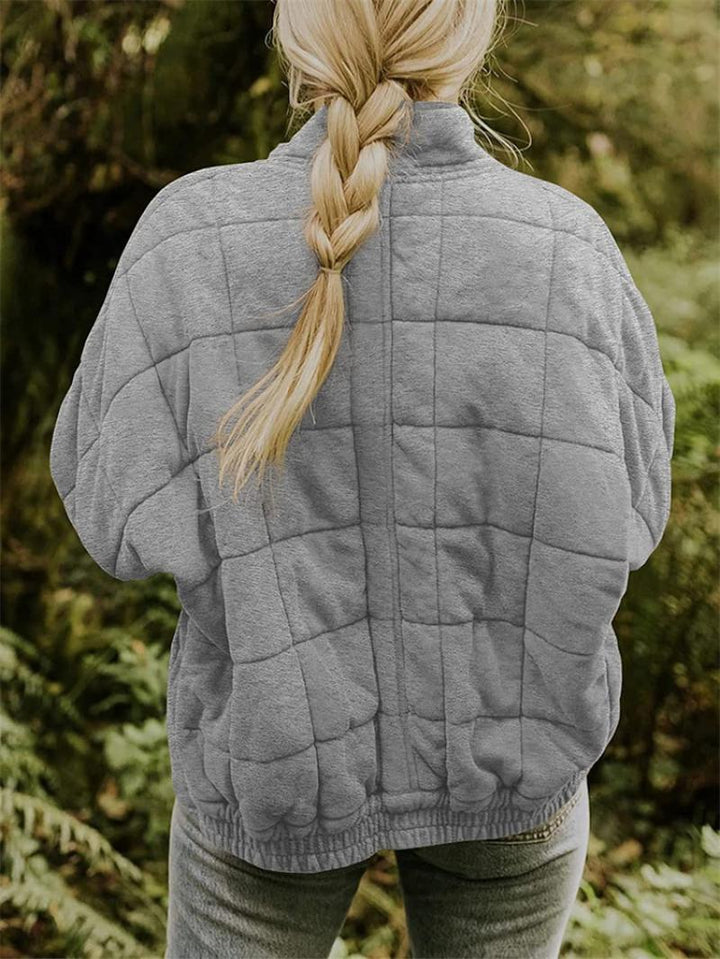 Women's casual quilted jacket with a convenient zip front, great for everyday stylish layering.