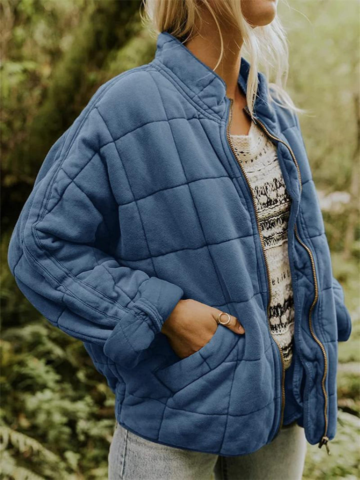 Chic women's quilted jacket, a versatile zip-front casual outerwear piece with stand collar.