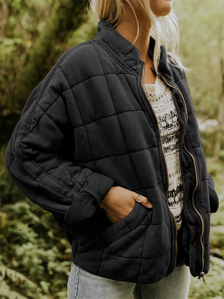 Durable women's quilted zip-front jacket, a stylish casual outerwear choice with a stand collar.