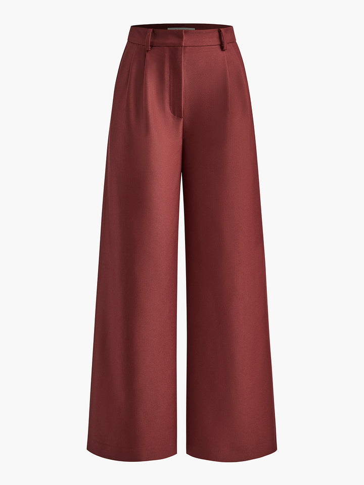 Model posing in beige tailored wide-leg trousers, sophisticated look