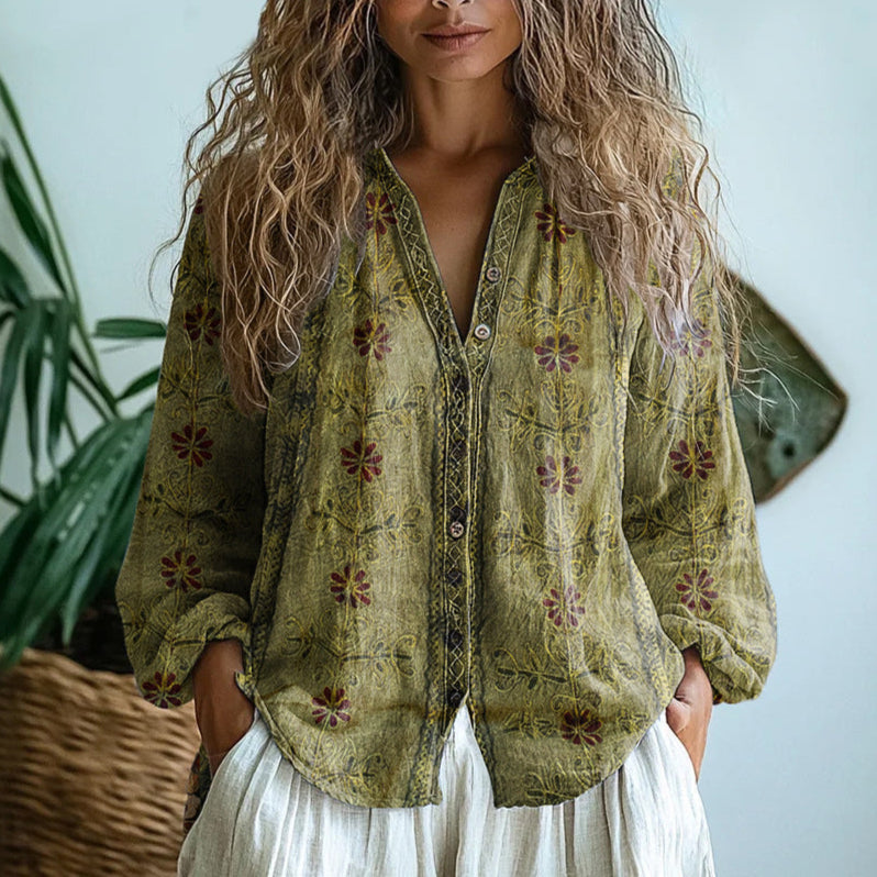 Chic women's top featuring a vibrant nature-inspired print and comfortable relaxed fit.