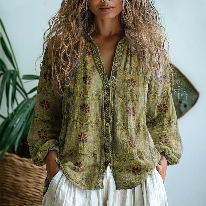 Chic women's top featuring a vibrant nature-inspired print and comfortable relaxed fit.