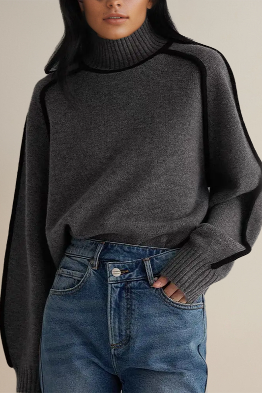Cozy knit turtleneck sweater for women. Features a relaxed fit and long sleeves, great for winter comfort.
